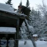 unknown pond hike 006 Russ helping to clean off the roof on the Headwaters Camp