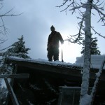 unknown pond hike 007 Luke shoveling all that ice and snow for Norm on the camp.